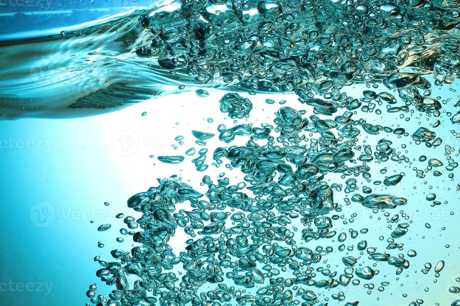 Fresh Water With Underwater Bubbles Texture on a Blue Background Close-up Abstract Liquid Bubbles Aqua Design Wallpaper photo