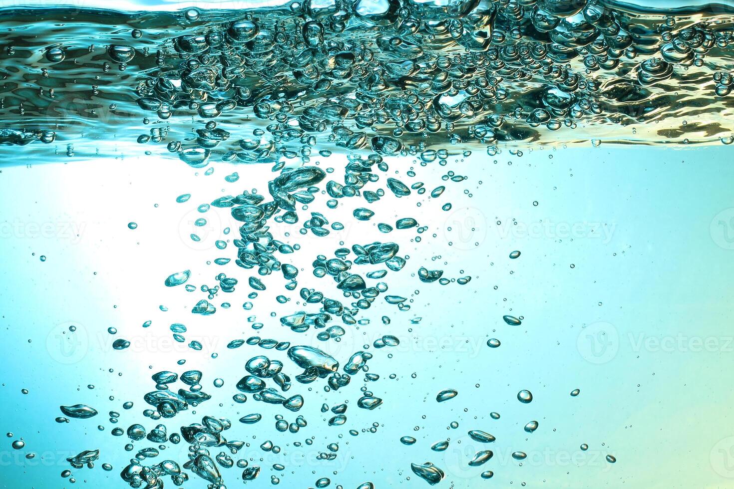 Fresh Water With Underwater Bubbles Texture on a Blue Background Close-up Abstract Liquid Bubbles Aqua Design Wallpaper photo