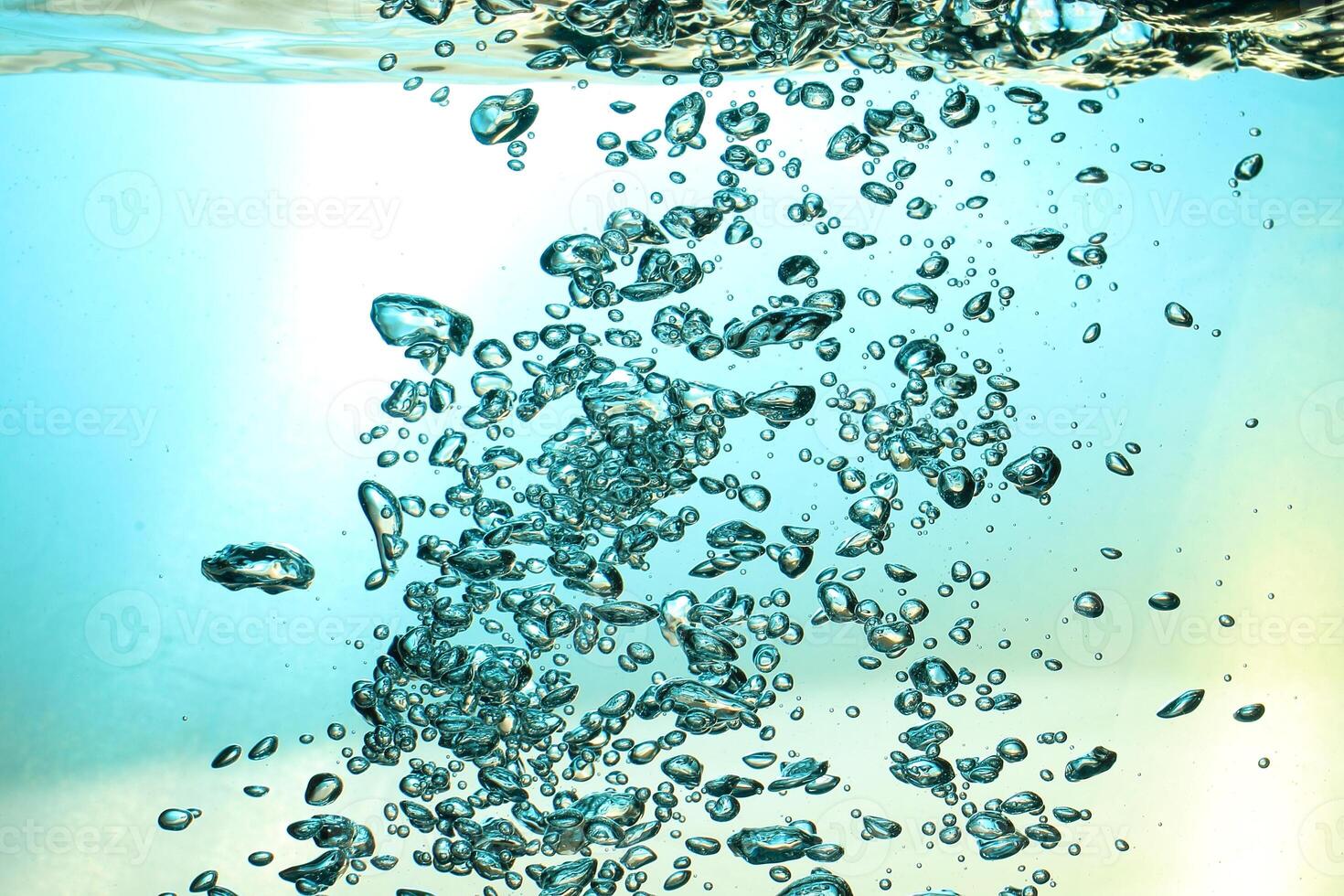 Fresh Water With Underwater Bubbles Texture on a Blue Background Close-up Abstract Liquid Bubbles Aqua Design Wallpaper photo