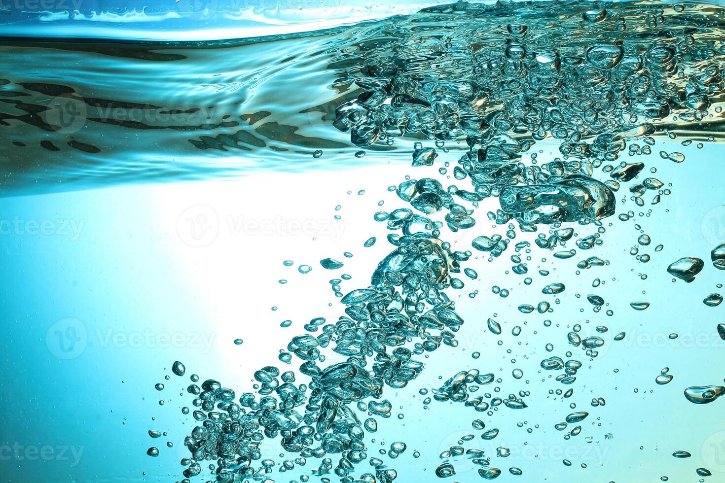 Fresh Water With Underwater Bubbles Texture on a Blue Background Close-up Abstract Liquid Bubbles Aqua Design Wallpaper photo