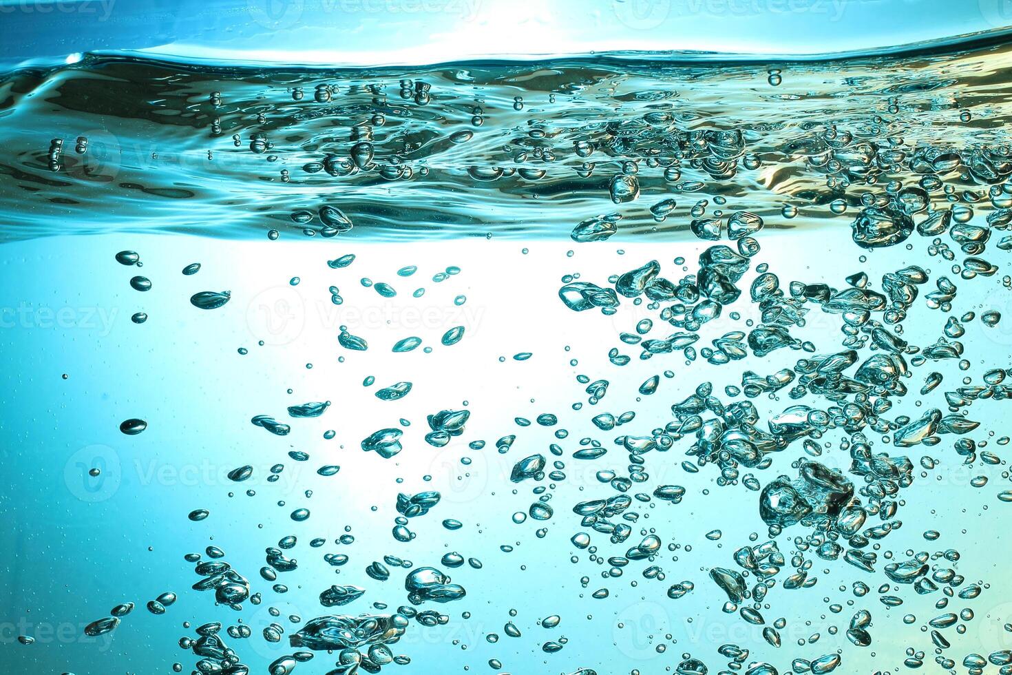Fresh Water With Underwater Bubbles Texture on a Blue Background Close-up Abstract Liquid Bubbles Aqua Design Wallpaper photo
