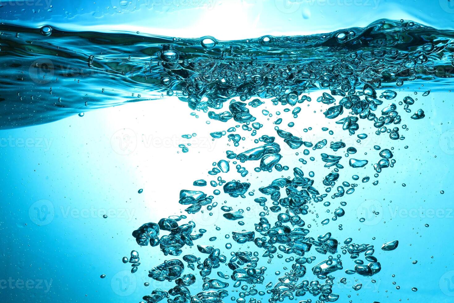 Fresh Water With Underwater Bubbles Texture on a Blue Background Close-up Abstract Liquid Bubbles Aqua Design Wallpaper photo