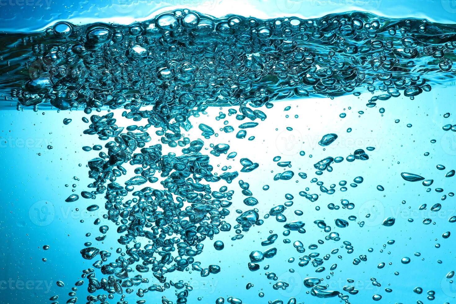 Fresh Water With Underwater Bubbles Texture on a Blue Background Close-up Abstract Liquid Bubbles Aqua Design Wallpaper photo