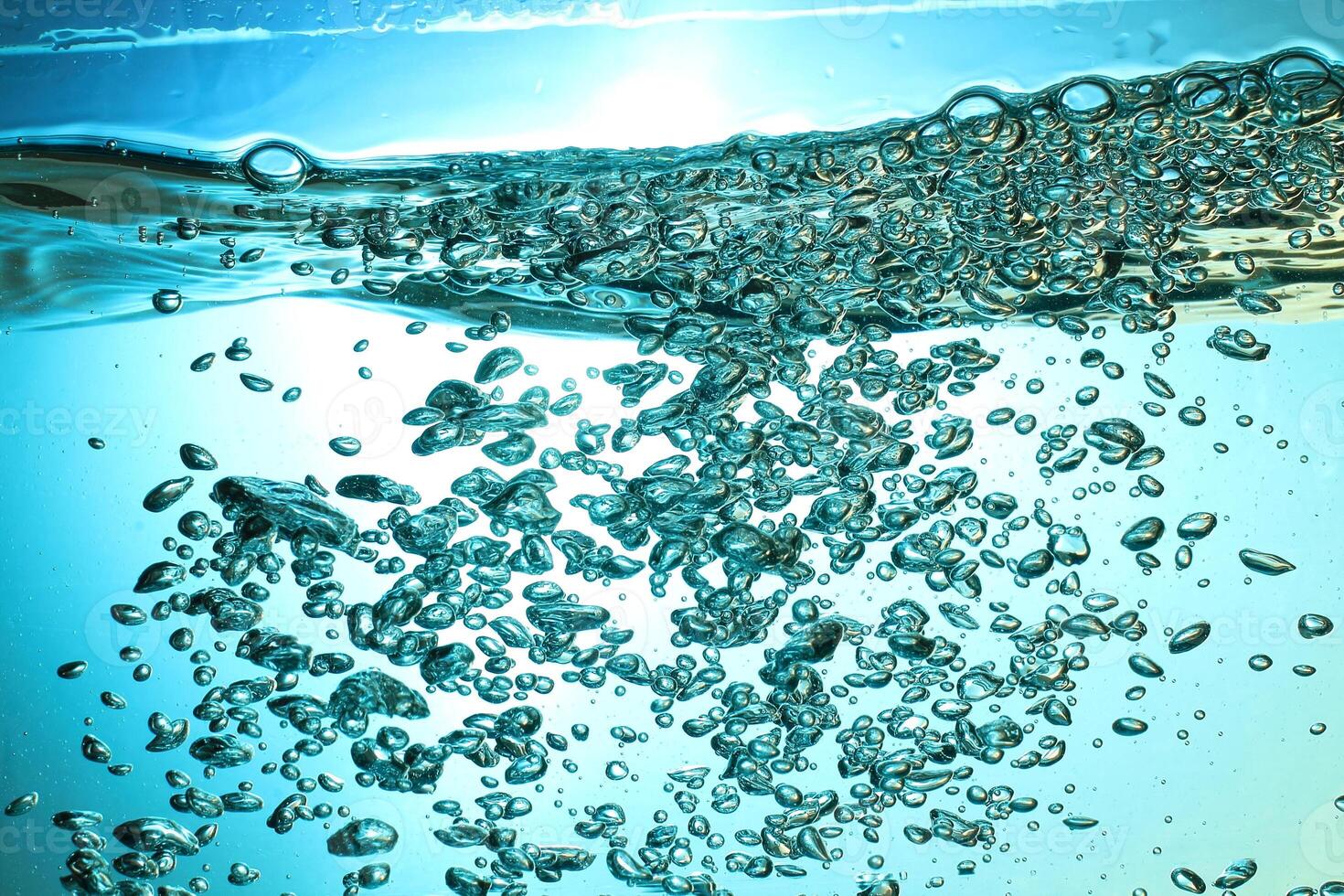 Fresh Water With Underwater Bubbles Texture on a Blue Background Close-up Abstract Liquid Bubbles Aqua Design Wallpaper photo