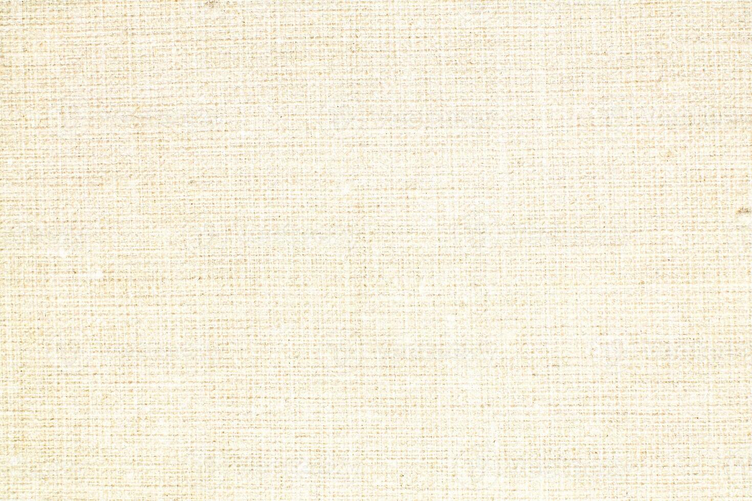 Natural Linen Material Textile Canvas Fabric Texture Background Close-up Detail of Fabric Natural Color Hemp Material Pattern Design Wallpaper. Can be Used as Background or For Graphic Design photo