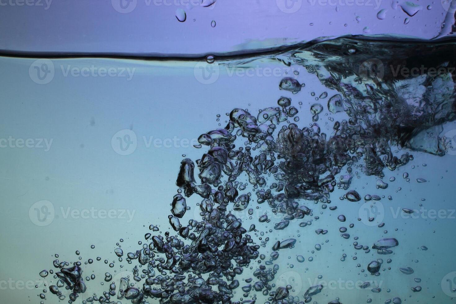 Fresh Water With Underwater Bubbles Texture on a Blue Background Close-up Abstract Liquid Bubbles Aqua Design Wallpaper photo