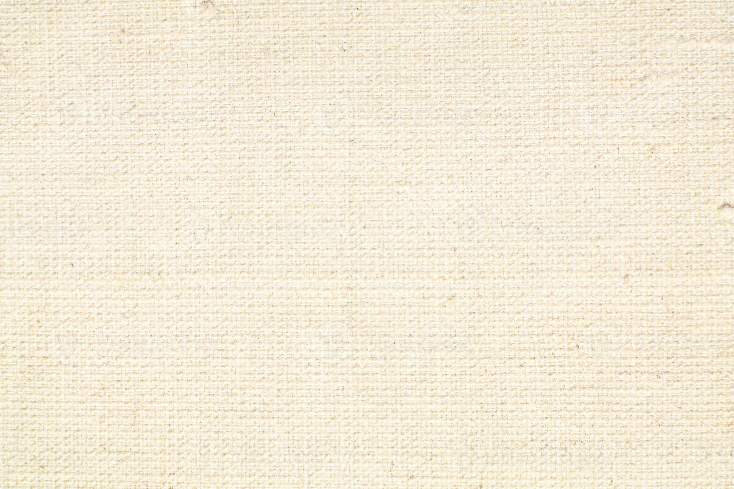 Natural Linen Material Textile Canvas Fabric Texture Background Close-up Detail of Fabric Natural Color Hemp Material Pattern Design Wallpaper. Can be Used as Background or For Graphic Design photo