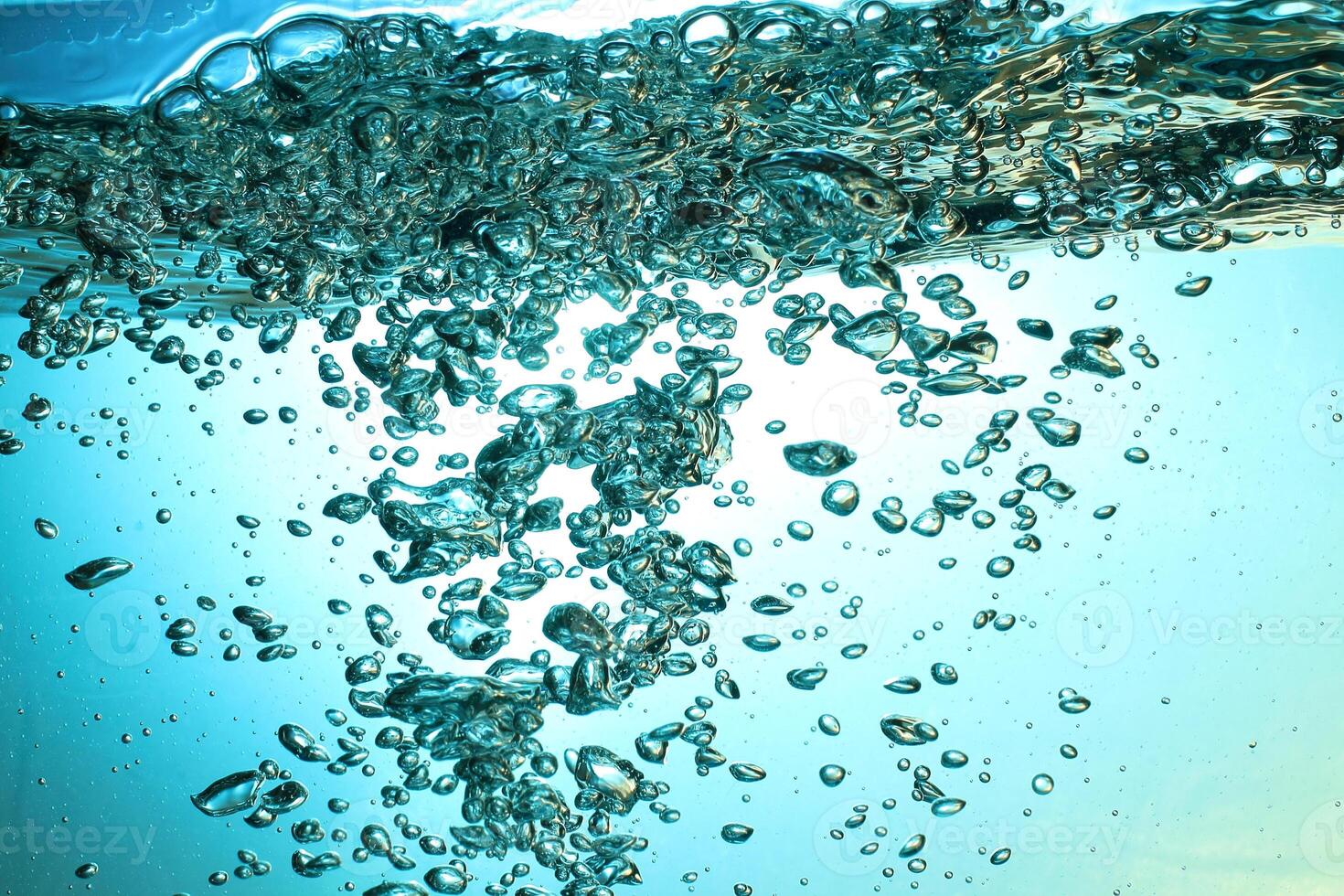 Fresh Water With Underwater Bubbles Texture on a Blue Background Close-up Abstract Liquid Bubbles Aqua Design Wallpaper photo