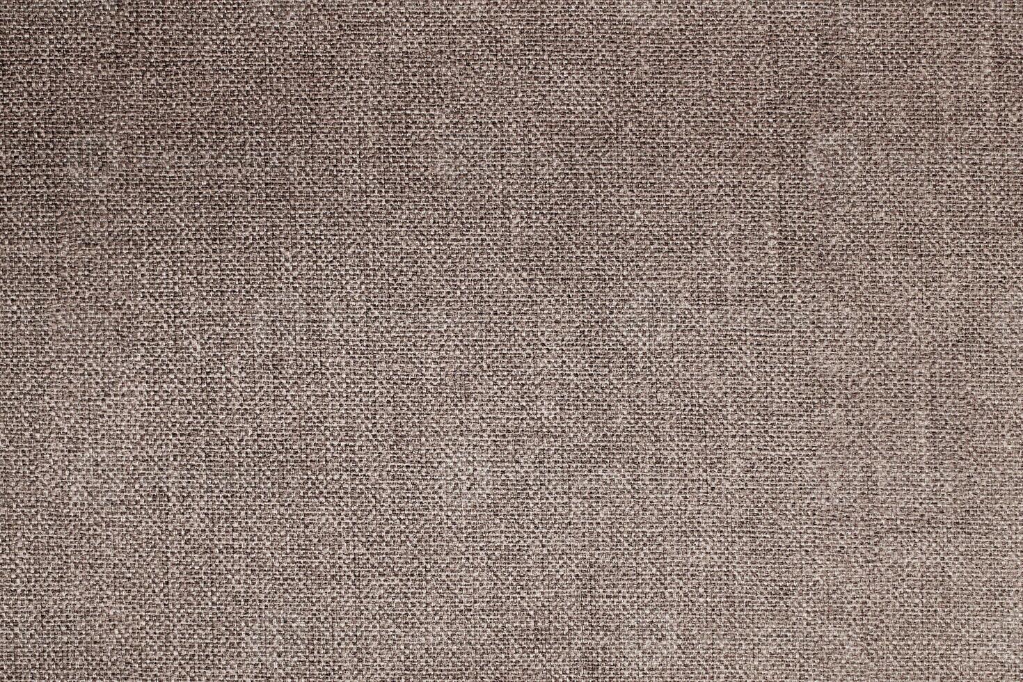Natural Linen Material Textile Canvas Fabric Texture Background Close-up Detail of Fabric Natural Color Hemp Material Pattern Design Wallpaper. Can be Used as Background or For Graphic Design photo