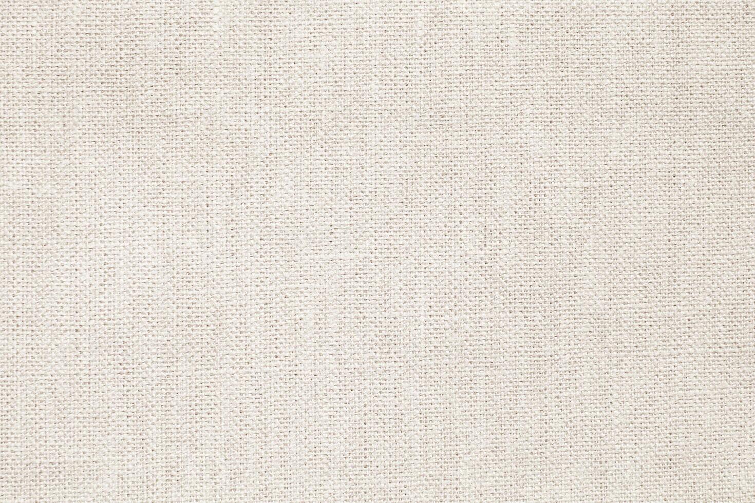 Natural Linen Material Textile Canvas Fabric Texture Background Close-up Detail of Fabric Natural Color Hemp Material Pattern Design Wallpaper. Can be Used as Background or For Graphic Design photo