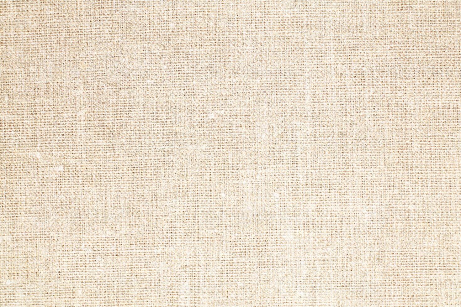 Natural Linen Material Textile Canvas Fabric Texture Background Close-up Detail of Fabric Natural Color Hemp Material Pattern Design Wallpaper. Can be Used as Background or For Graphic Design photo