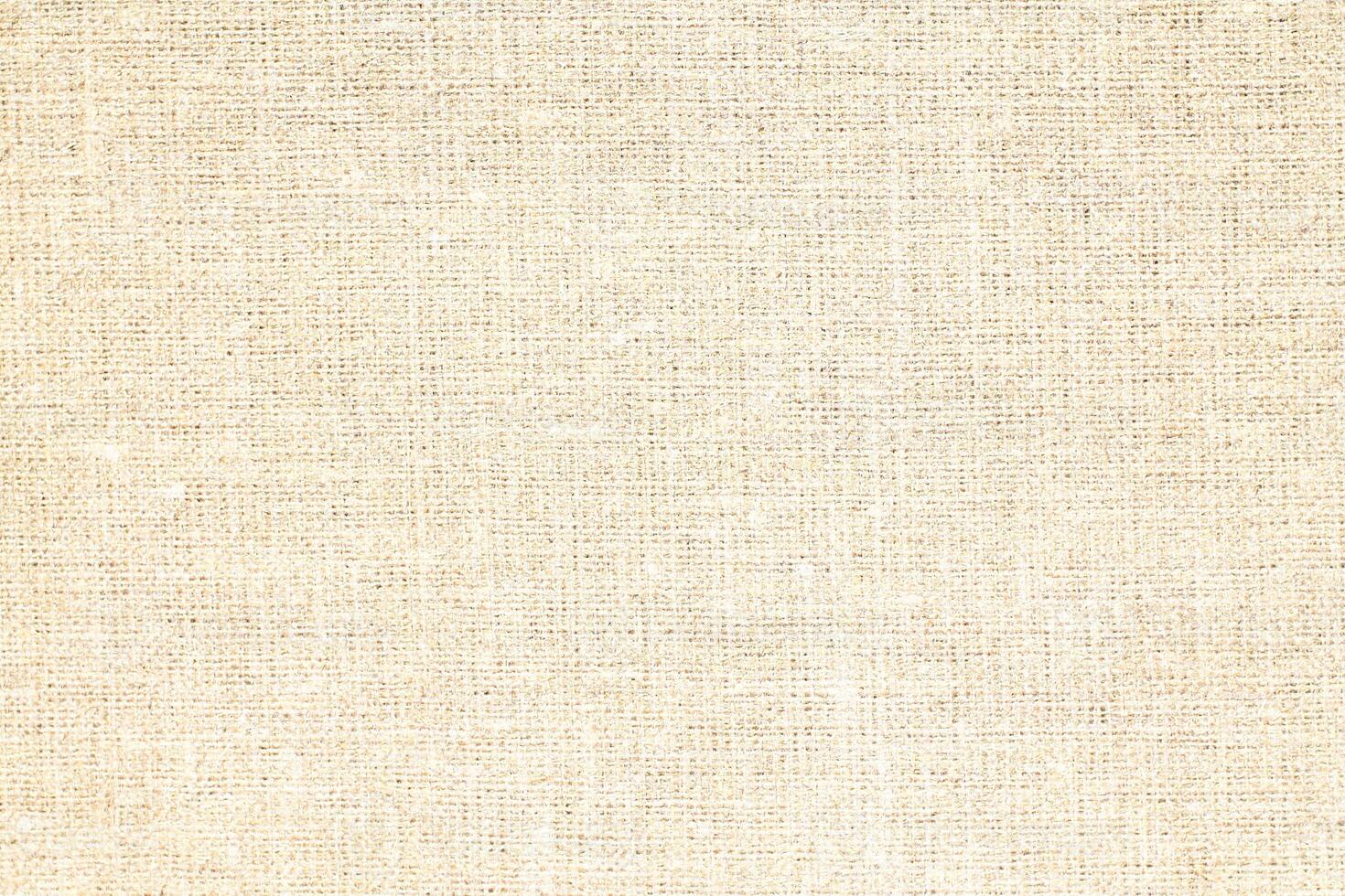 Natural Linen Material Textile Canvas Fabric Texture Background Close-up Detail of Fabric Natural Color Hemp Material Pattern Design Wallpaper. Can be Used as Background or For Graphic Design photo