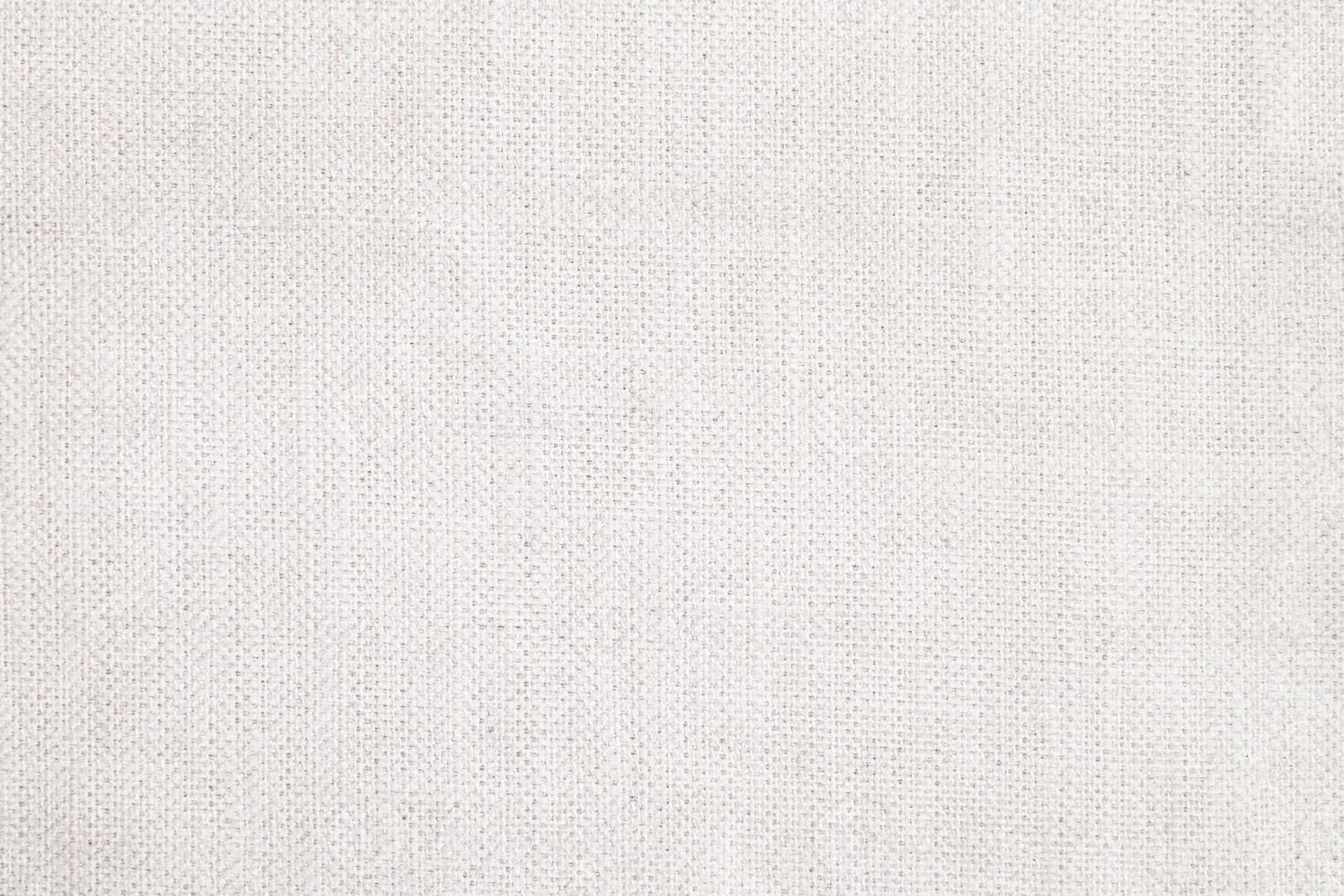 Natural Linen Material Textile Canvas Fabric Texture Background Close-up Detail of Fabric Natural Color Hemp Material Pattern Design Wallpaper. Can be Used as Background or For Graphic Design photo