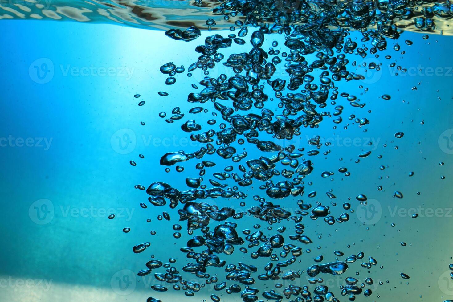 Fresh Water With Underwater Bubbles Texture on a Blue Background Close-up Abstract Liquid Bubbles Aqua Design Wallpaper photo