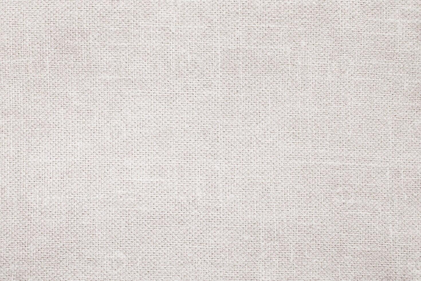 Natural Linen Material Textile Canvas Fabric Texture Background Close-up Detail of Fabric Natural Color Hemp Material Pattern Design Wallpaper. Can be Used as Background or For Graphic Design photo