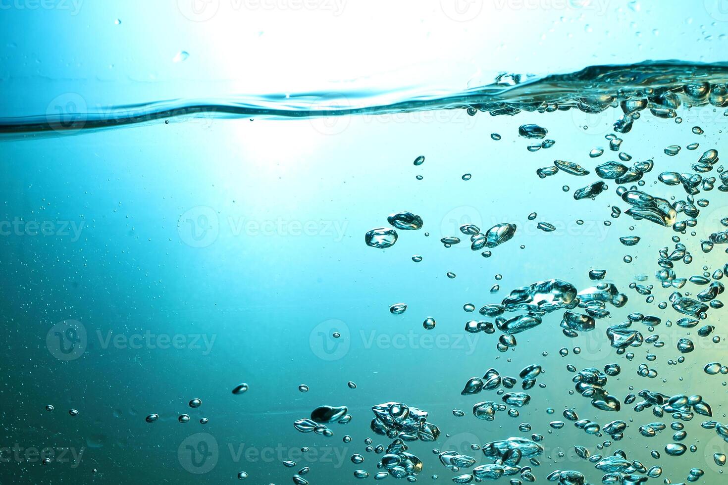 Fresh Water With Underwater Bubbles Texture on a Blue Background Close-up Abstract Liquid Bubbles Aqua Design Wallpaper photo