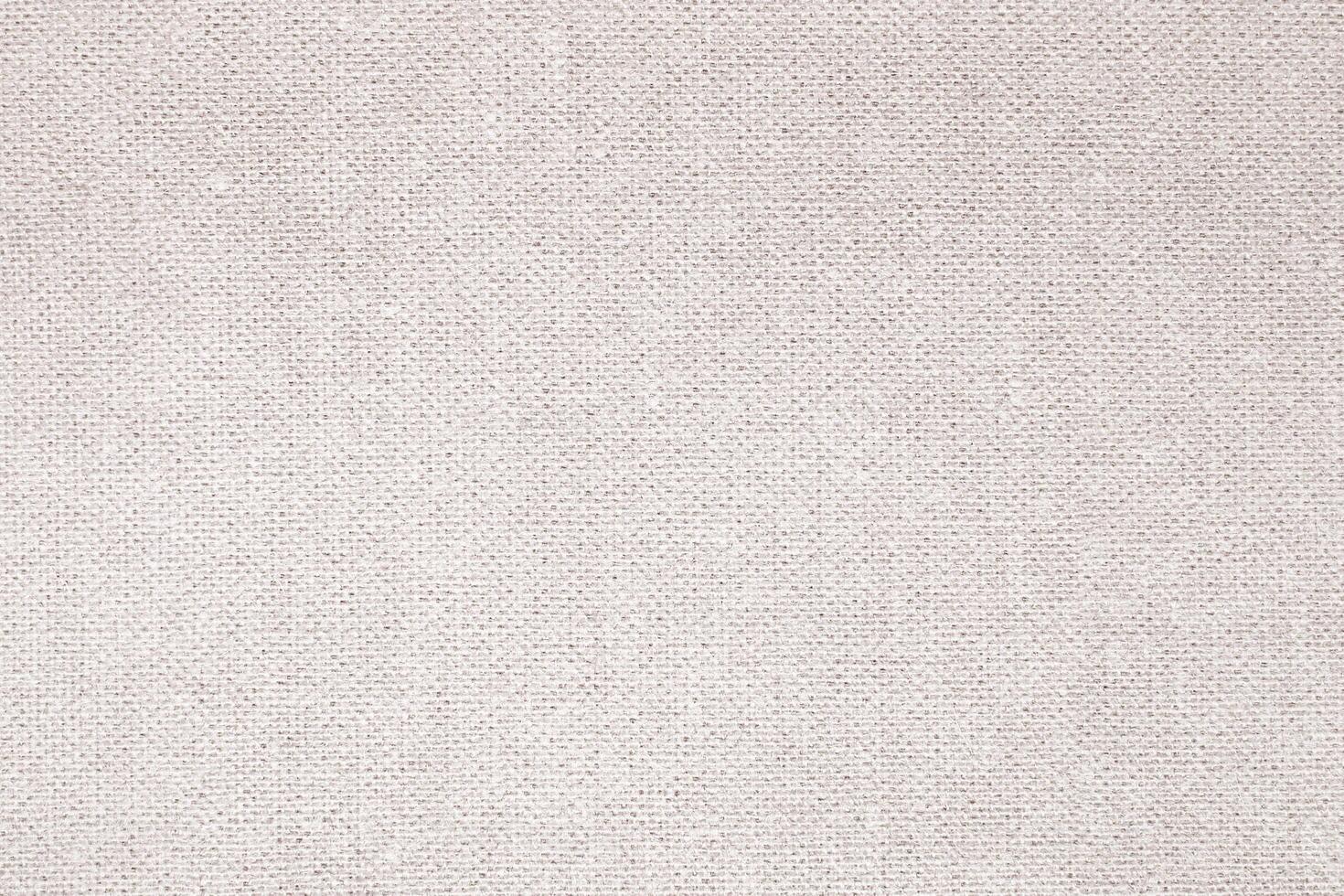 Natural Linen Material Textile Canvas Fabric Texture Background Close-up Detail of Fabric Natural Color Hemp Material Pattern Design Wallpaper. Can be Used as Background or For Graphic Design photo