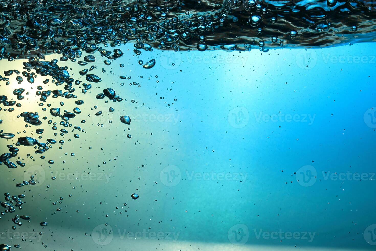 Fresh Water With Underwater Bubbles Texture on a Blue Background Close-up Abstract Liquid Bubbles Aqua Design Wallpaper photo