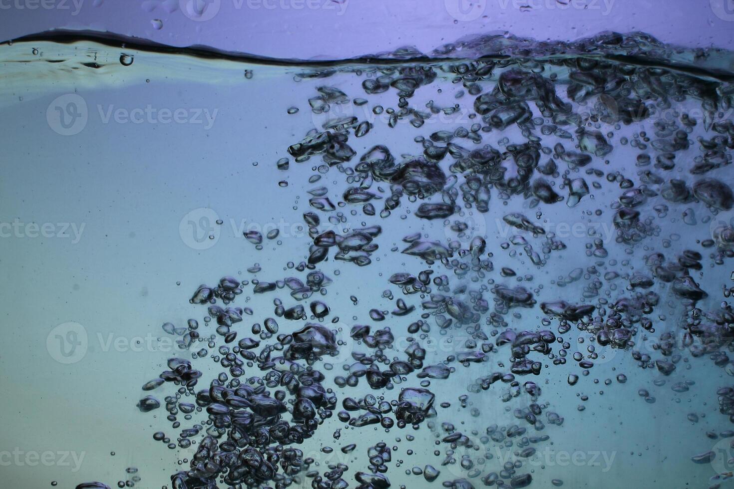 Fresh Water With Underwater Bubbles Texture on a Blue Background Close-up Abstract Liquid Bubbles Aqua Design Wallpaper photo