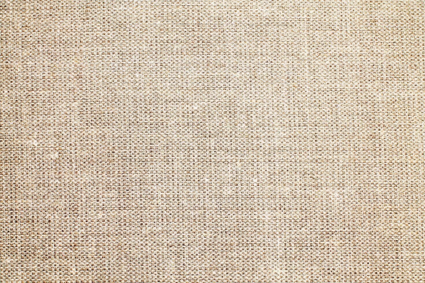Natural Linen Material Textile Canvas Fabric Texture Background Close-up Detail of Fabric Natural Color Hemp Material Pattern Design Wallpaper. Can be Used as Background or For Graphic Design photo