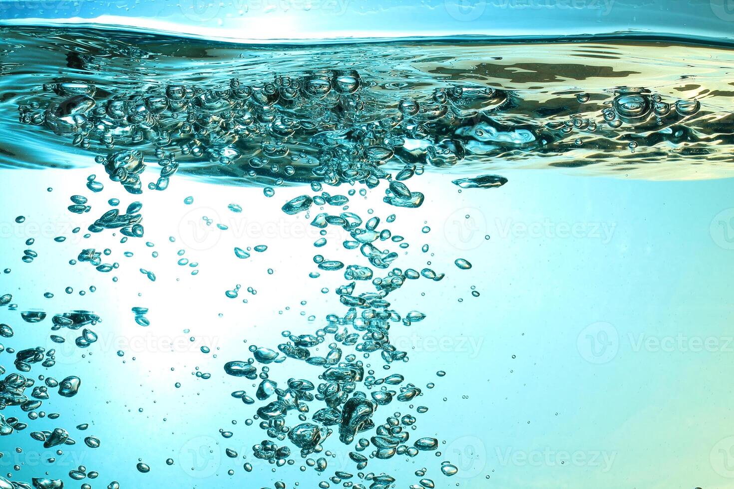 Fresh Water With Underwater Bubbles Texture on a Blue Background Close-up Abstract Liquid Bubbles Aqua Design Wallpaper photo