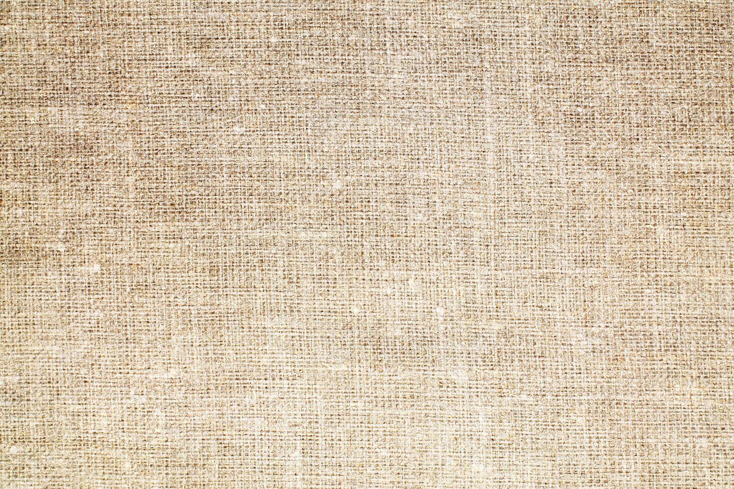 Natural Linen Material Textile Canvas Fabric Texture Background Close-up Detail of Fabric Natural Color Hemp Material Pattern Design Wallpaper. Can be Used as Background or For Graphic Design photo