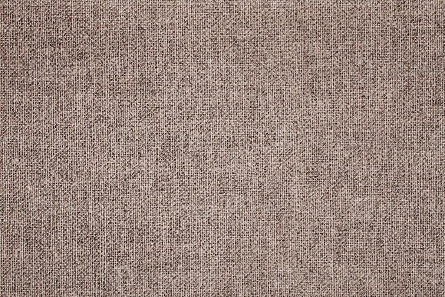 Natural Linen Material Textile Canvas Fabric Texture Background Close-up Detail of Fabric Natural Color Hemp Material Pattern Design Wallpaper. Can be Used as Background or For Graphic Design photo