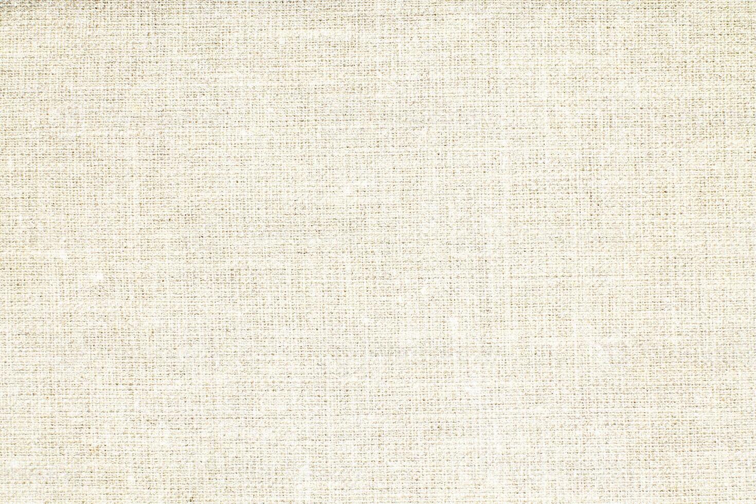 Natural Linen Material Textile Canvas Fabric Texture Background Close-up Detail of Fabric Natural Color Hemp Material Pattern Design Wallpaper. Can be Used as Background or For Graphic Design photo