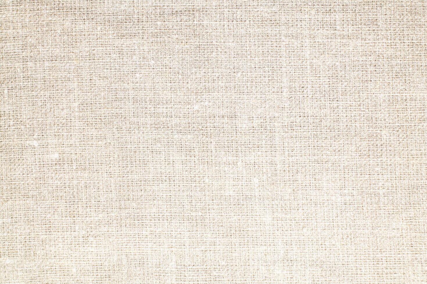 Natural Linen Material Textile Canvas Fabric Texture Background Close-up Detail of Fabric Natural Color Hemp Material Pattern Design Wallpaper. Can be Used as Background or For Graphic Design photo
