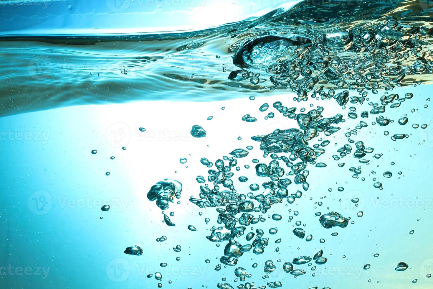 Fresh Water With Underwater Bubbles Texture on a Blue Background Close-up Abstract Liquid Bubbles Aqua Design Wallpaper photo
