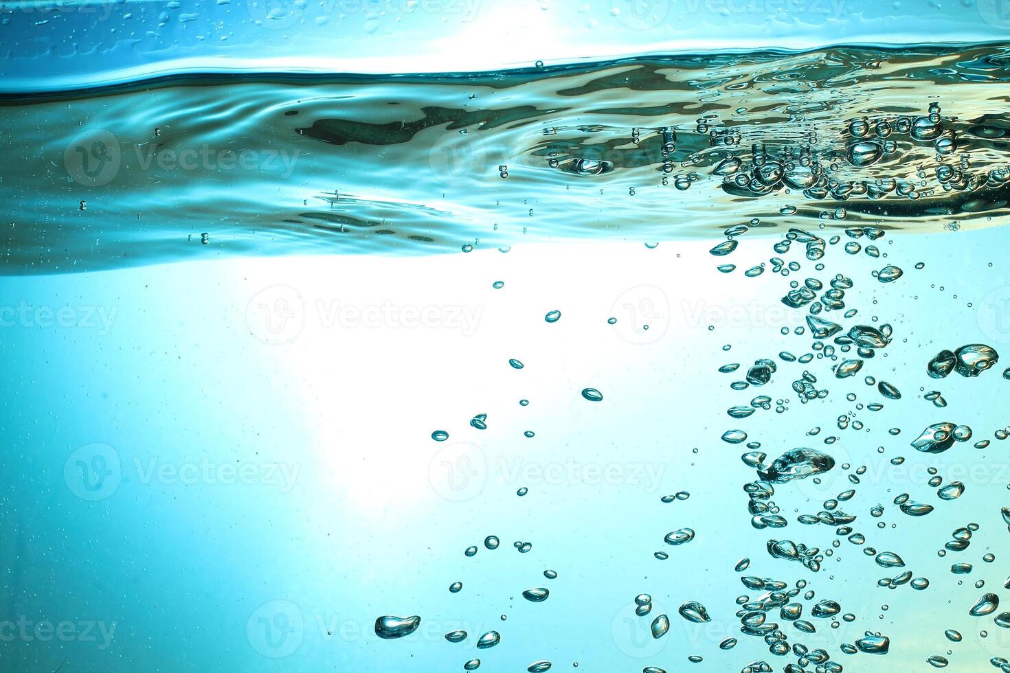 Fresh Water With Underwater Bubbles Texture on a Blue Background Close-up Abstract Liquid Bubbles Aqua Design Wallpaper photo