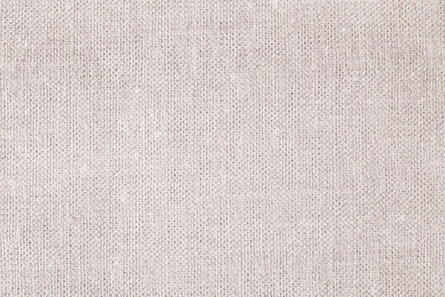 Natural Linen Material Textile Canvas Fabric Texture Background Close-up Detail of Fabric Natural Color Hemp Material Pattern Design Wallpaper. Can be Used as Background or For Graphic Design photo