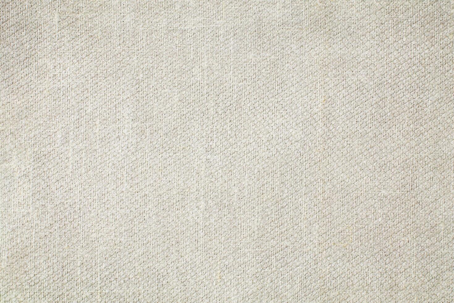 Natural Linen Material Textile Canvas Fabric Texture Background Close-up Detail of Fabric Natural Color Hemp Material Pattern Design Wallpaper. Can be Used as Background or For Graphic Design photo