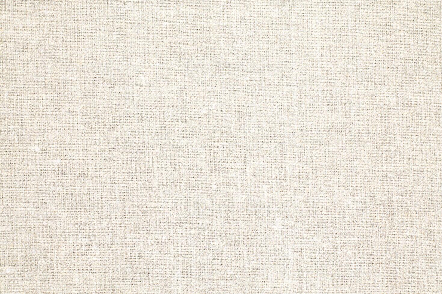Natural Linen Material Textile Canvas Fabric Texture Background Close-up Detail of Fabric Natural Color Hemp Material Pattern Design Wallpaper. Can be Used as Background or For Graphic Design photo