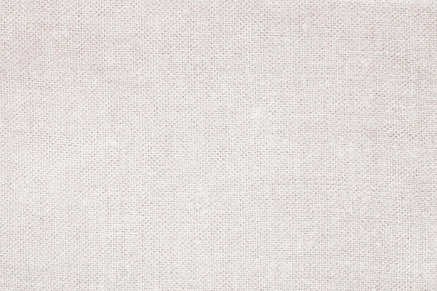 Natural Linen Material Textile Canvas Fabric Texture Background Close-up Detail of Fabric Natural Color Hemp Material Pattern Design Wallpaper. Can be Used as Background or For Graphic Design photo