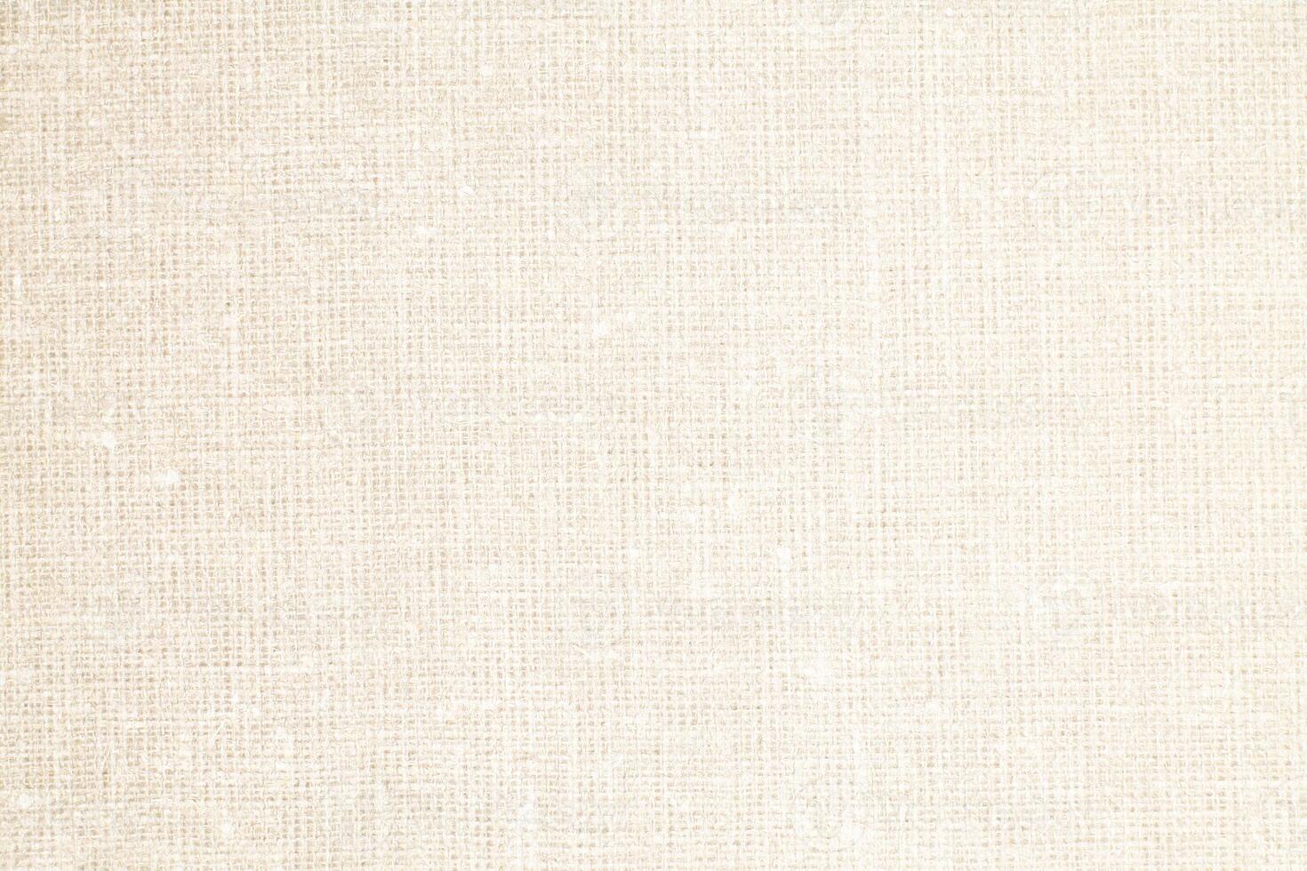 Natural Linen Material Textile Canvas Fabric Texture Background Close-up Detail of Fabric Natural Color Hemp Material Pattern Design Wallpaper. Can be Used as Background or For Graphic Design photo