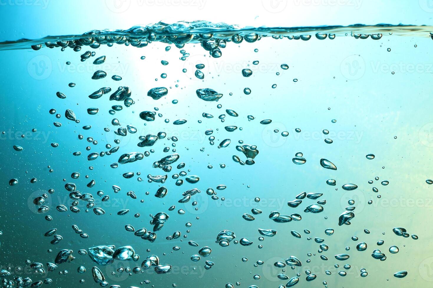 Fresh Water With Underwater Bubbles Texture on a Blue Background Close-up Abstract Liquid Bubbles Aqua Design Wallpaper photo