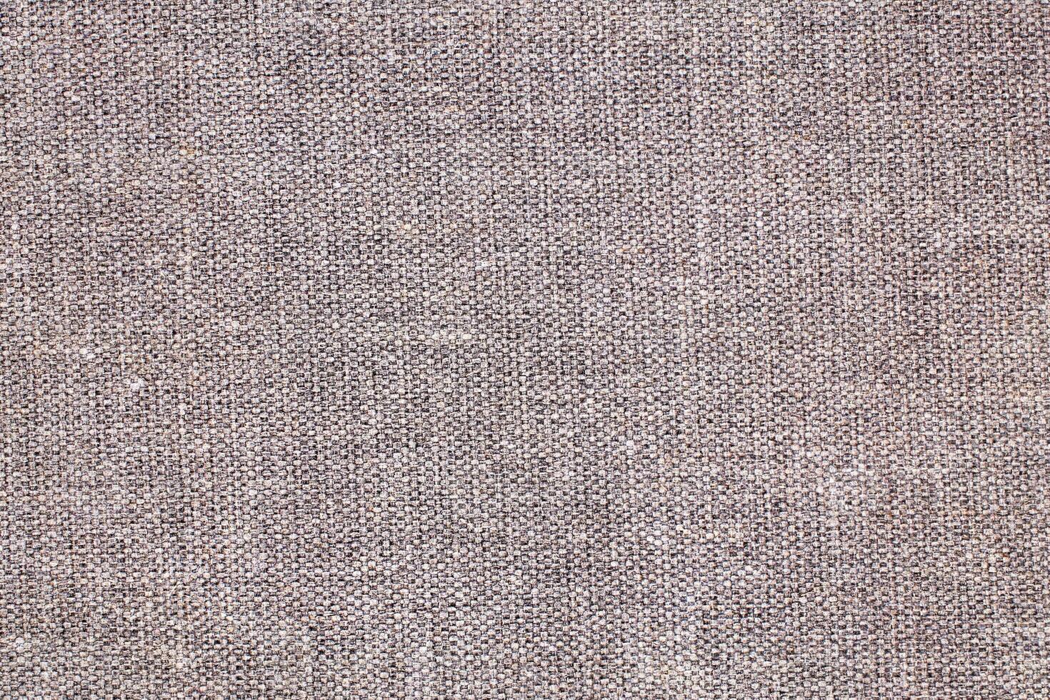 Natural Linen Material Textile Canvas Fabric Texture Background Close-up Detail of Fabric Natural Color Hemp Material Pattern Design Wallpaper. Can be Used as Background or For Graphic Design photo