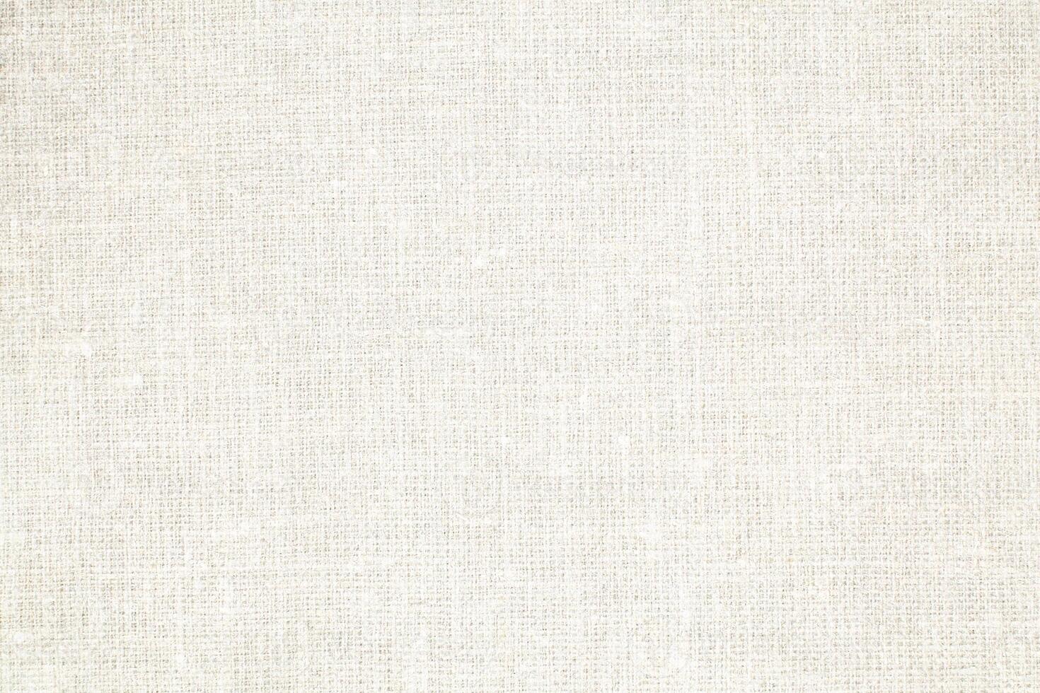 Natural Linen Material Textile Canvas Fabric Texture Background Close-up Detail of Fabric Natural Color Hemp Material Pattern Design Wallpaper. Can be Used as Background or For Graphic Design photo
