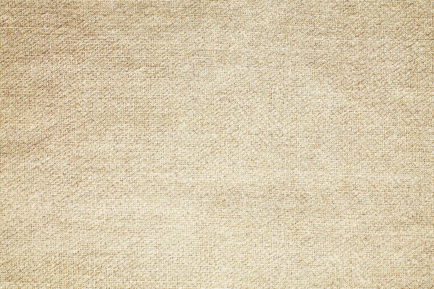 Natural Linen Material Textile Canvas Fabric Texture Background Close-up Detail of Fabric Natural Color Hemp Material Pattern Design Wallpaper. Can be Used as Background or For Graphic Design photo