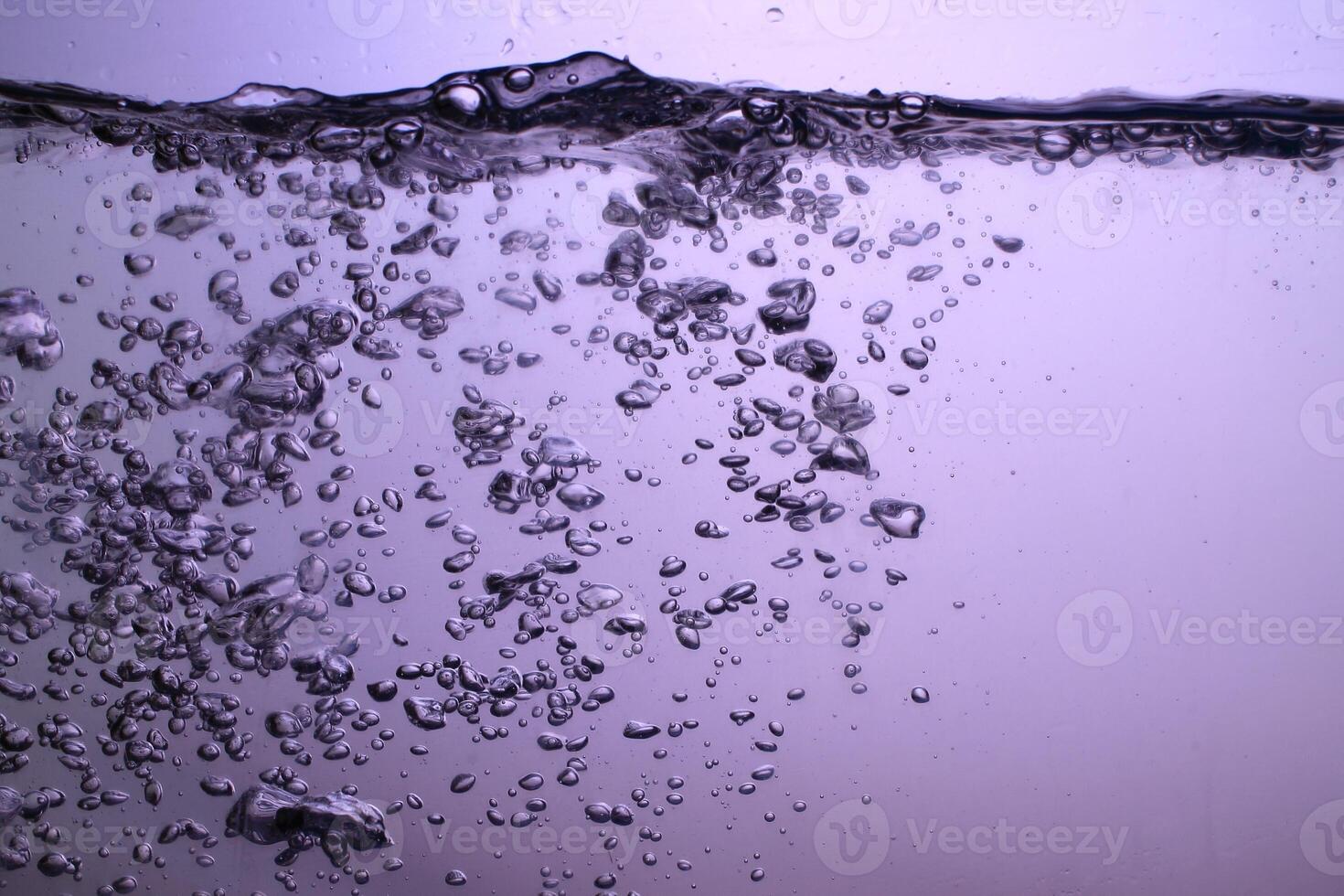 Fresh Water With Underwater Bubbles Texture on a Blue Background Close-up Abstract Liquid Bubbles Aqua Design Wallpaper photo