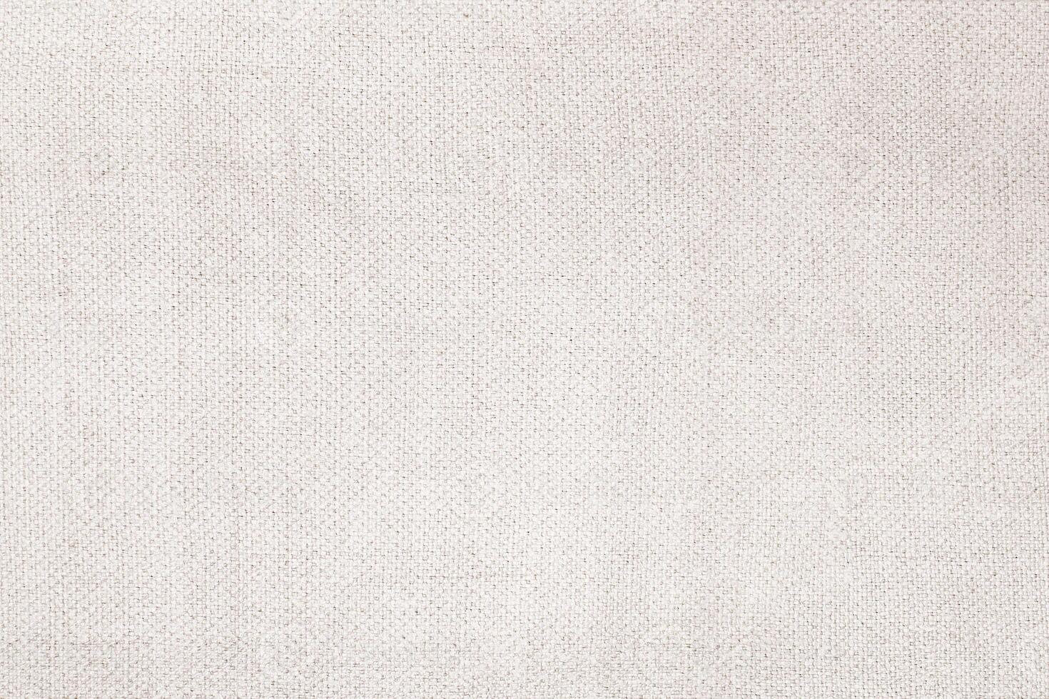 Natural Linen Material Textile Canvas Fabric Texture Background Close-up Detail of Fabric Natural Color Hemp Material Pattern Design Wallpaper. Can be Used as Background or For Graphic Design photo
