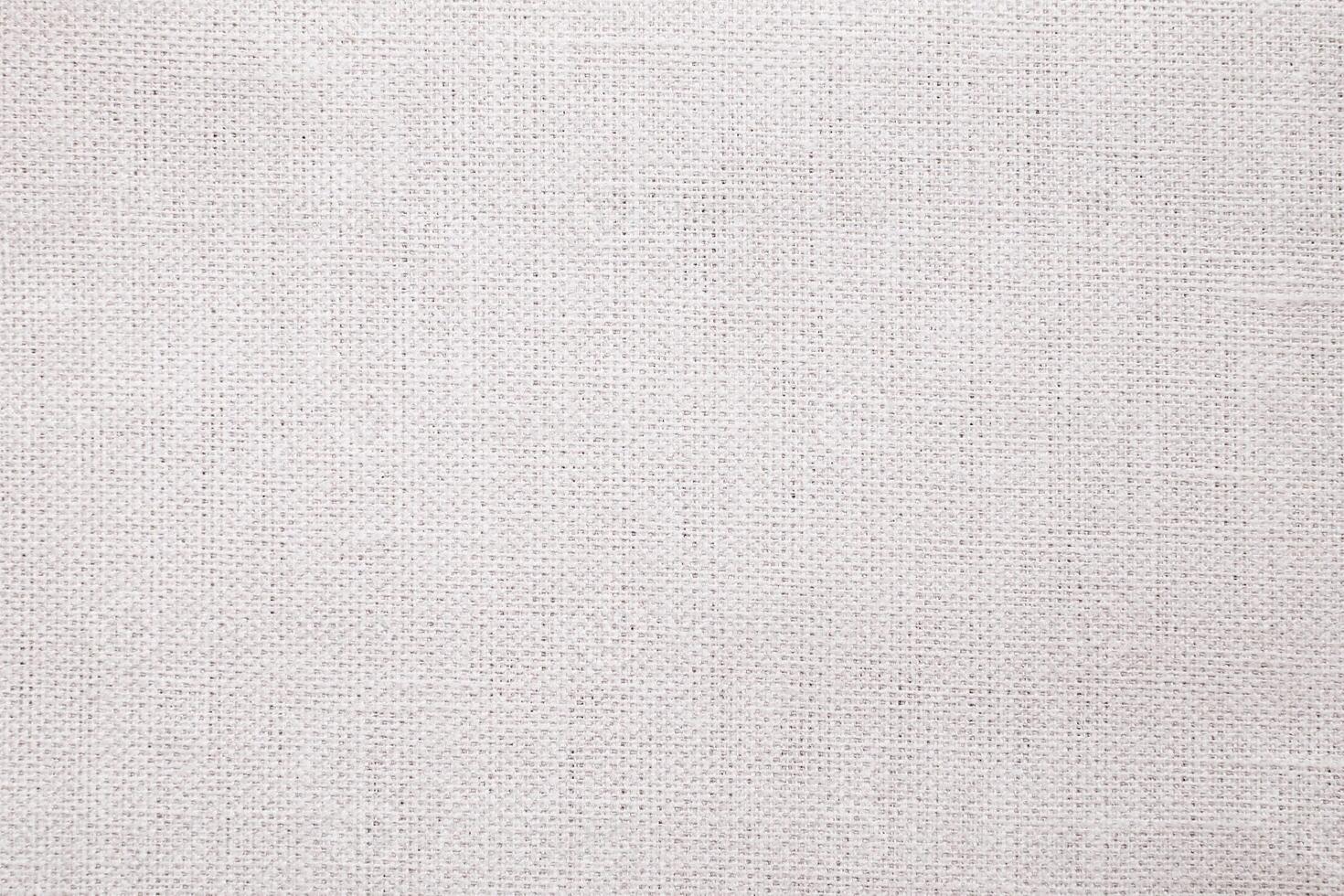 Natural Linen Material Textile Canvas Fabric Texture Background Close-up Detail of Fabric Natural Color Hemp Material Pattern Design Wallpaper. Can be Used as Background or For Graphic Design photo