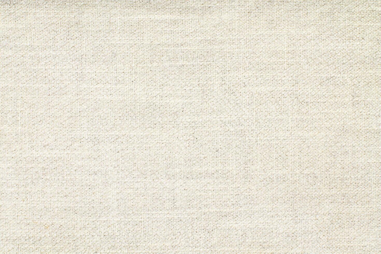 Natural Linen Material Textile Canvas Fabric Texture Background Close-up Detail of Fabric Natural Color Hemp Material Pattern Design Wallpaper. Can be Used as Background or For Graphic Design photo