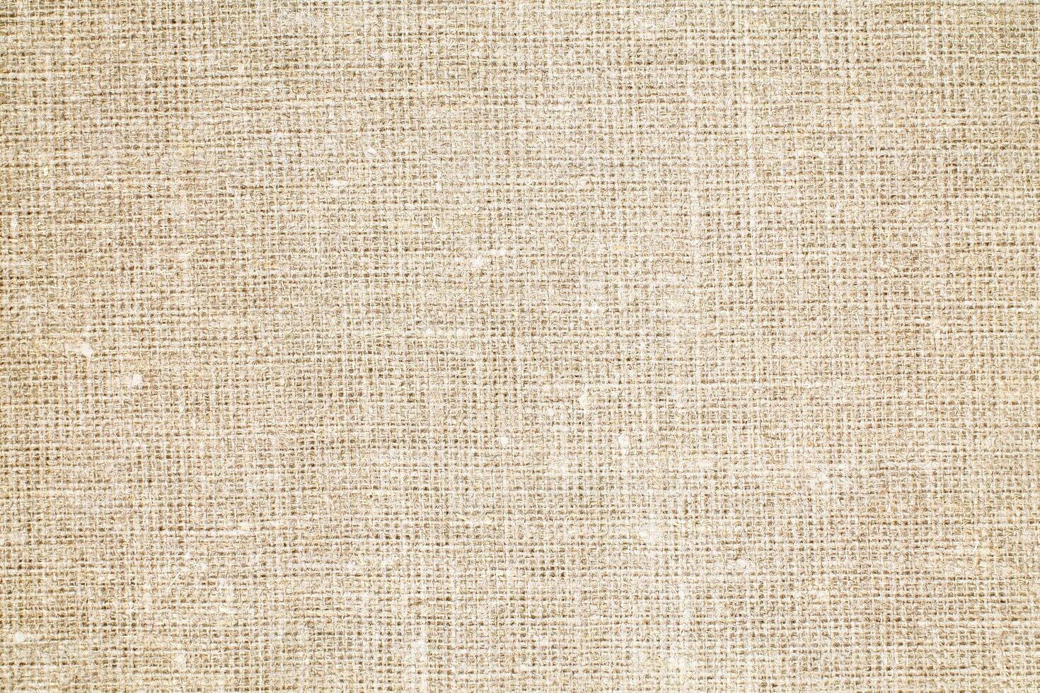 Natural Linen Material Textile Canvas Fabric Texture Background Close-up Detail of Fabric Natural Color Hemp Material Pattern Design Wallpaper. Can be Used as Background or For Graphic Design photo