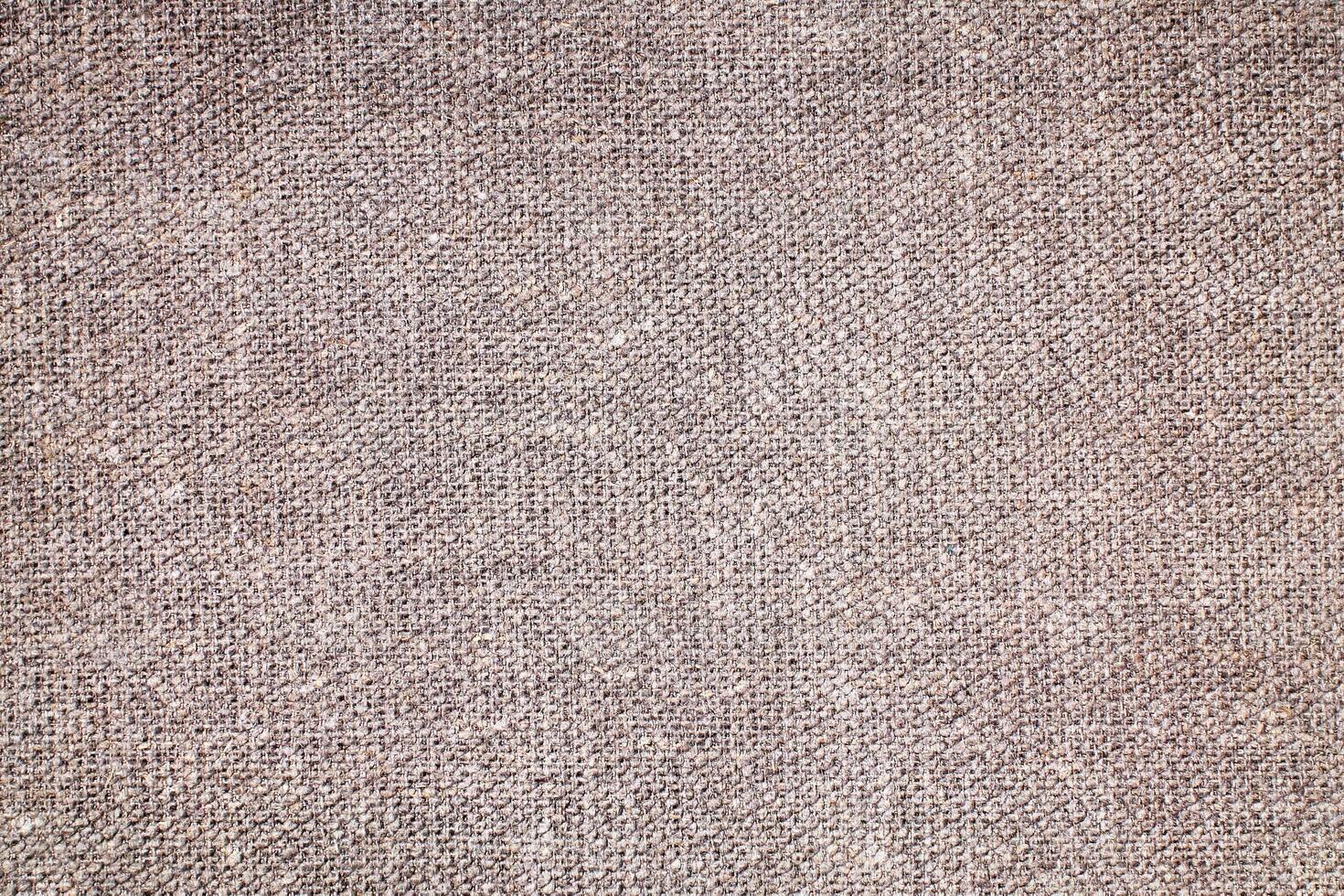 Natural Linen Material Textile Canvas Fabric Texture Background Close-up Detail of Fabric Natural Color Hemp Material Pattern Design Wallpaper. Can be Used as Background or For Graphic Design photo