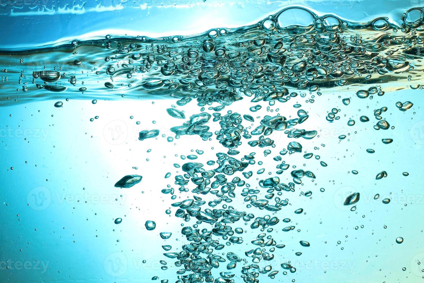 Fresh Water With Underwater Bubbles Texture on a Blue Background Close-up Abstract Liquid Bubbles Aqua Design Wallpaper photo