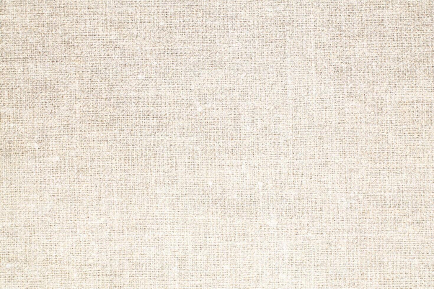Natural Linen Material Textile Canvas Fabric Texture Background Close-up Detail of Fabric Natural Color Hemp Material Pattern Design Wallpaper. Can be Used as Background or For Graphic Design photo
