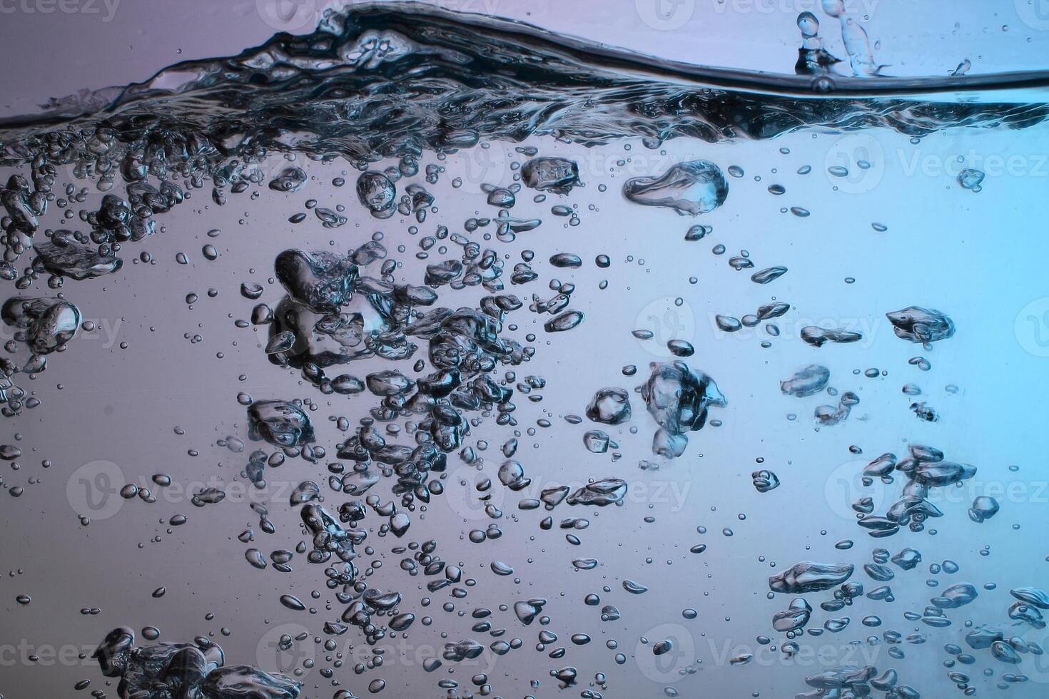 Fresh Water With Underwater Bubbles Texture on a Blue Background Close-up Abstract Liquid Bubbles Aqua Design Wallpaper photo