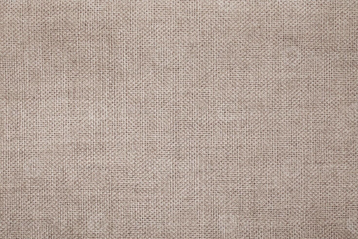 Natural Linen Material Textile Canvas Fabric Texture Background Close-up Detail of Fabric Natural Color Hemp Material Pattern Design Wallpaper. Can be Used as Background or For Graphic Design photo